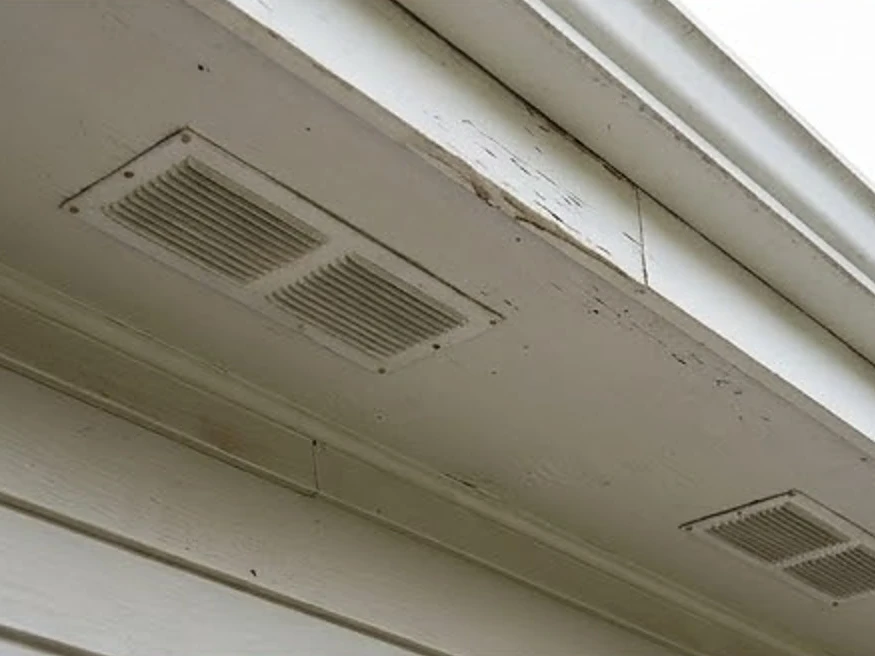 Soffit vents under the eave, older home: roof inspection in Rochester, MN