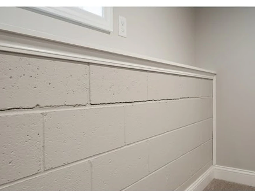 Horizontal crack in a block basement wall, finished-looking basement: foundation inspection in Mounds View, MN