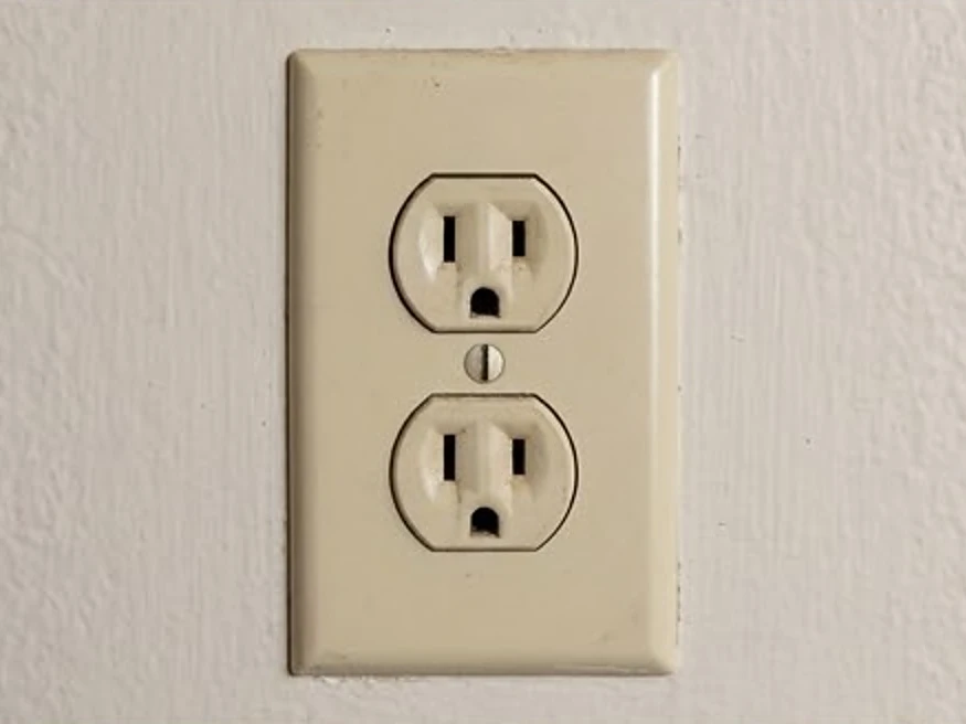 Ungrounded two-prong outlet, close-up: electrical inspection in Independence, IA