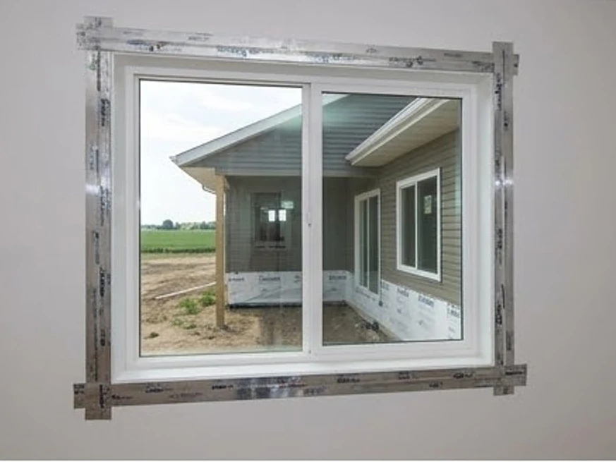 New window installed with flashing tape, Minnesota build site: new construction inspection in Fridley, MN