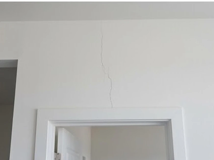 Small drywall nail pops on a wall, newer home: 11-month warranty inspection in Silver Lake, MN
