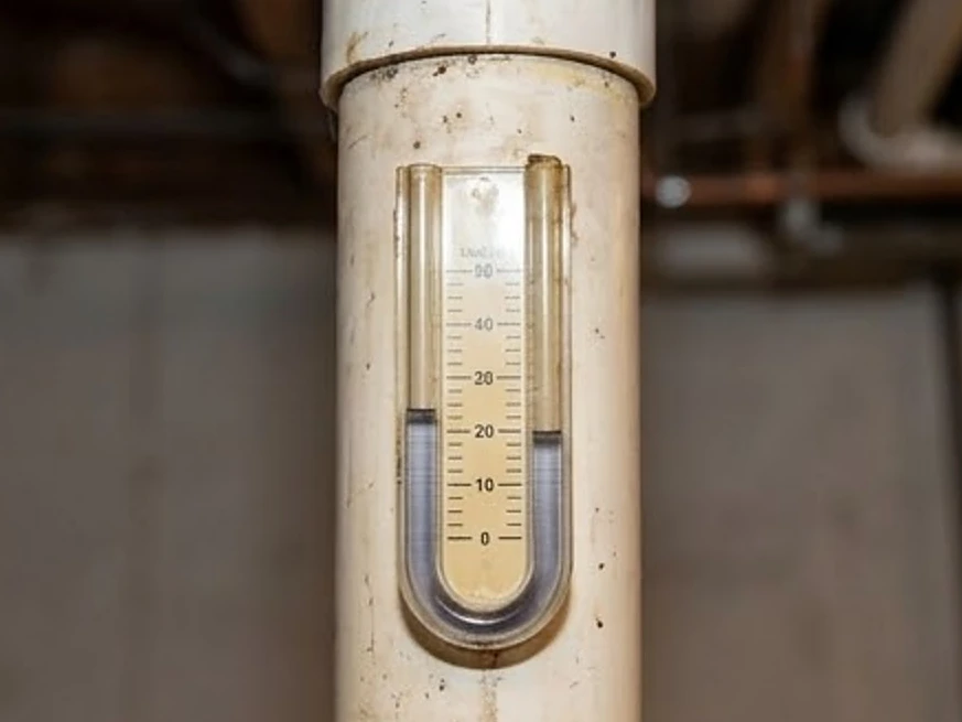 U-tube gauge reading level, older system: radon testing in Saint Paul, MN