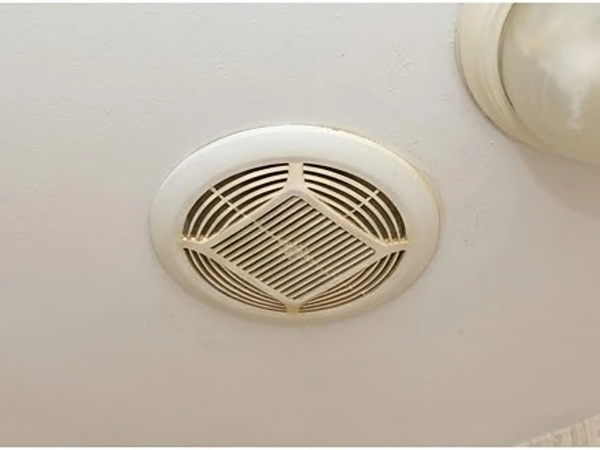 Bathroom exhaust fan in a ceiling, older home: mold inspection in Ottumwa, IA