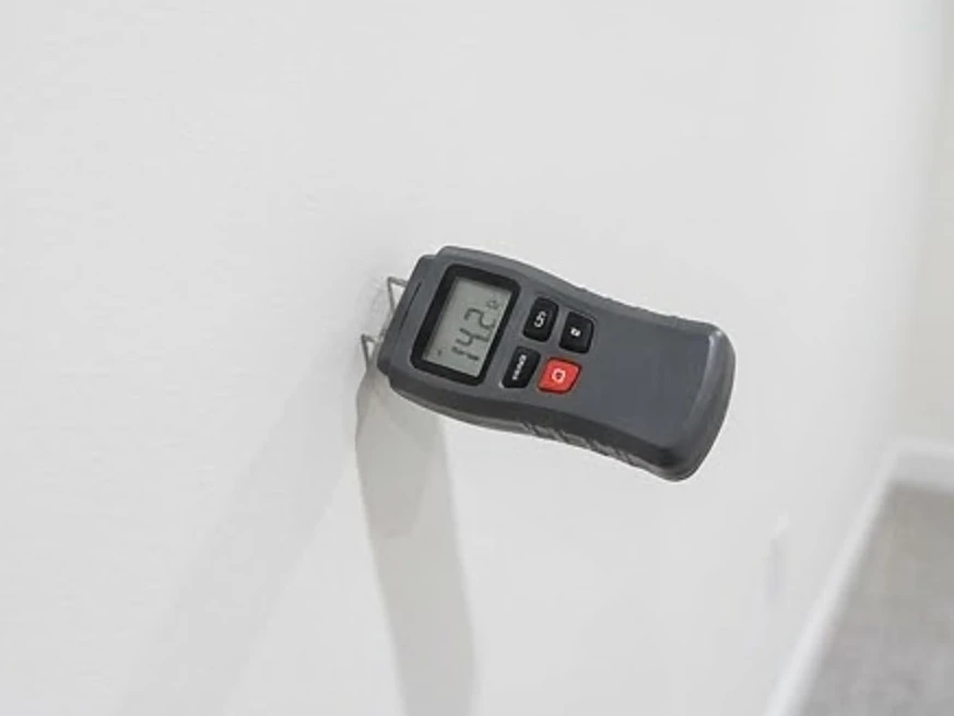 Moisture meter on drywall, newer basement: mold inspection in Lakeville, MN