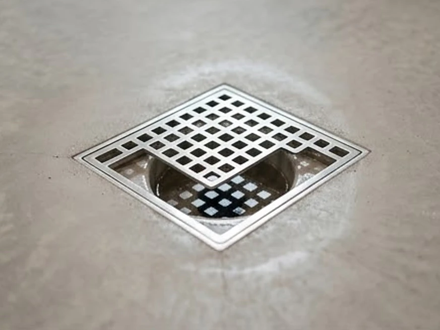 Basement floor drain with standing water, modern home: sewer scope inspection in Minneapolis, MN