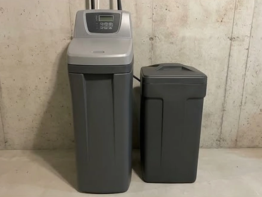 Water softener with brine tank in a newer Iowa basement: well water testing in Lambs Grove, IA