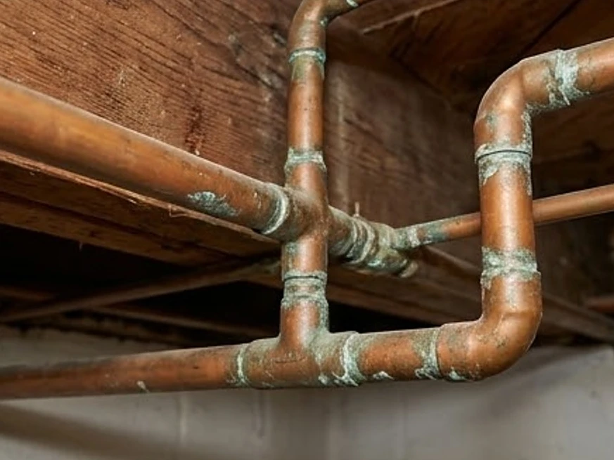 Soldered copper pipe joints on an older water line in an older Iowa basement (Appanoose County, Iowa)